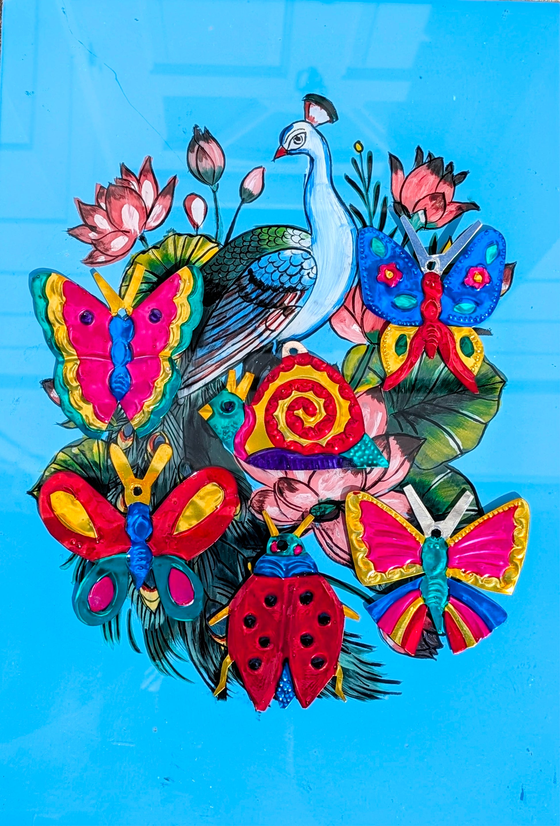 Beautiful, bright tin bugs and butterflies. Traditionally milagros are given to saints to ask for a miracle and commonly nailed to the lintel of a door in the home. These milagros have been made by the artisans in Oaxaca to depict all the flora and fauna of Mexico.
Handmade and handpainted tin - all pieces vary in size, and colour. 
Approx 12 cm tall on average

 