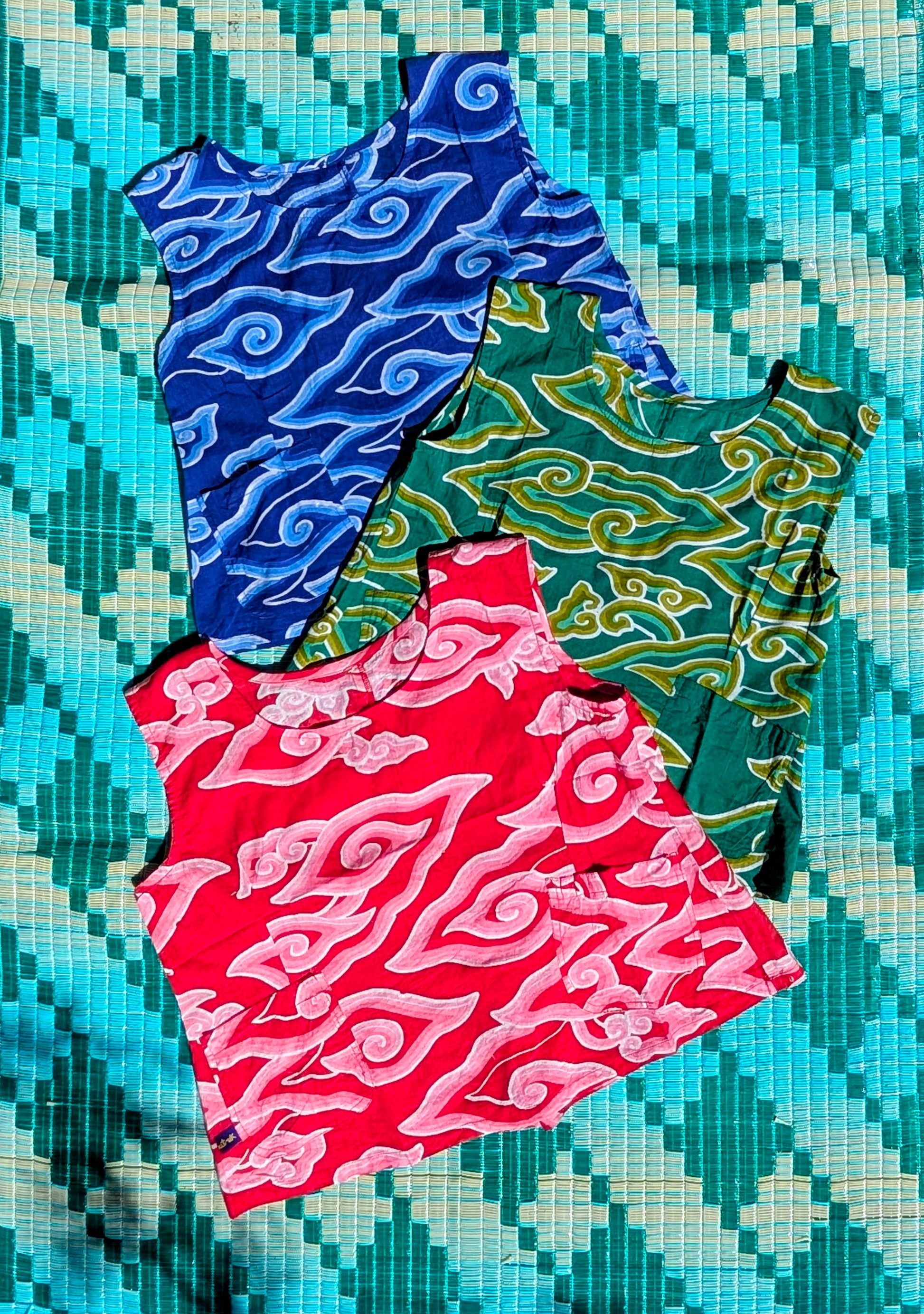Gorgeous soft fine cotton cool summer tops with a fabulous Indian print inspired by our favourite Javanese batik pattern, mega mendung (the clouds that cover the sun).

Patterns and sampling made here in the UK by our founder Anna Moody.

Measurements

Size 1-  34"bust, length drop from shoulder 19" (UK 10-12)

Size 2- 38" bust, length, drop from shoulder 20" (UK 12-14)

Size 3- 40" bust, length, drop from shoulder 21" (UK 14-16)

 Washing instructions....

To properly fix the colour print with the natural 