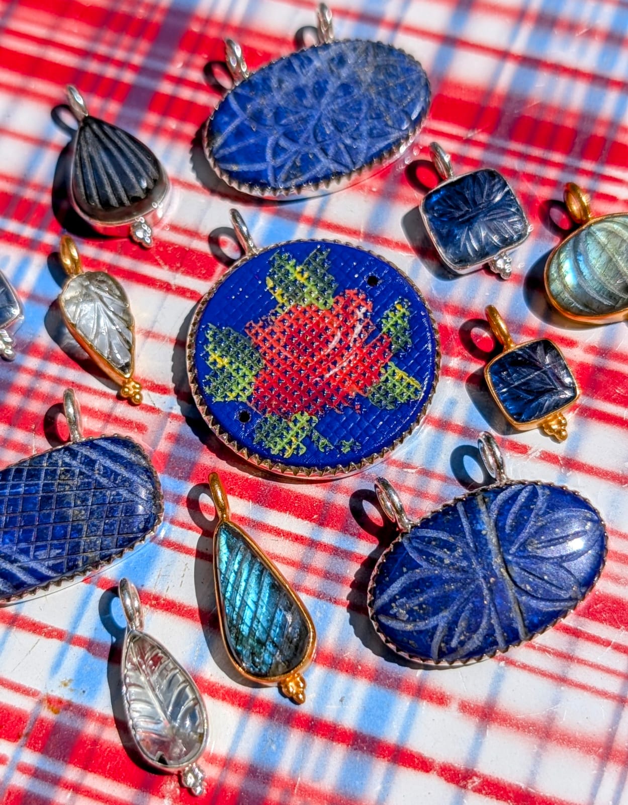 A gorgeous selection of hand carved stones we collected in Jaipur, Rajasthan, and a fabulous vintage glass, hand painted French rosey brooch finding, all set in fancy silver bezel or bobbles to make loveliest pendants, some we had gold plated, and some we left silver, something for everyone!

1 kyanite, 10 x 20mm silver
2 aquamarine,  24 x 8mm gold plated
3 labradorite, 20 x 20mm, gold plated 
4 painted glass, 30 x 37mm, silver.
5 lapis lazuli, 32 x 27mm, silver
6 kyanite, 12 x 20mm, silver.
7 lapis lazuli,