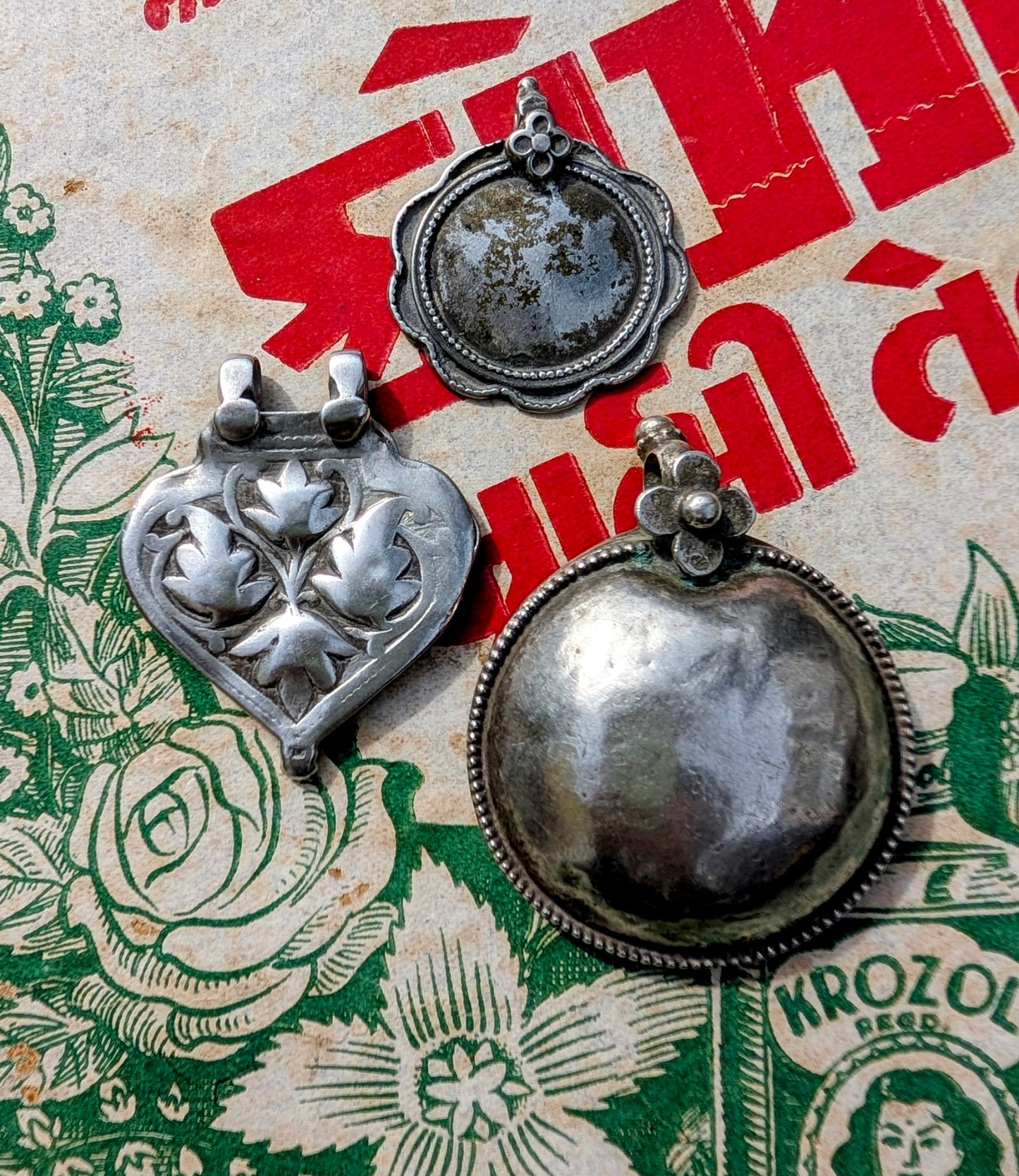 Antique silver floral pendants