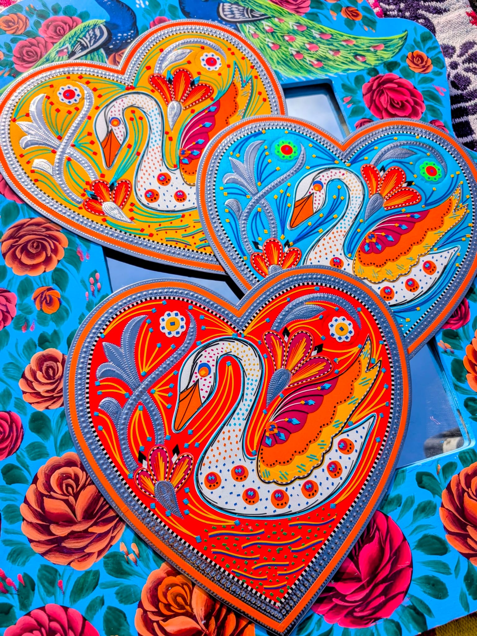 Stunning, sturdy metal love hearts, hand punched and decorated with true loving swans, depicted in razor cut vinyl by the truck artists of Pakistan

These traditionally are used to decorate the trucks outside or in, and are really beautifully made.

30 x 30cm

Chromed steel, vinyl sticker, fabric backed.

 

 