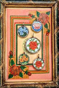 In the language of flowers, the rose is true love, the lotus is rebirth, purity and strength, the nasturtium is joy, creativity and wellness, and the forget-me-not is true love and memories
Made in Rajasthan, these pendants are crafted from sterling silver, glass and hand painted images on paper. The fine craftsmanship in these paintings is mind blowing, painting with single paint brush bristles!!!

These pendants should be removed when washing/swimming etc as they are in effect framed pieces of art, that a