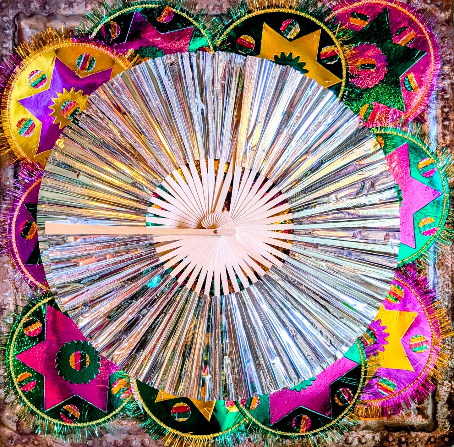 Super shiny silver fans for dancing, parties, festivals and steamy menopause moments!!

Love that these are a space age update on a traditionally made bamboo frame fan!!

Also make fabulous display pieces on hooks, walls or shelves.

Bamboo and plastic foil.

Open 42.5cm x 26cm approx 