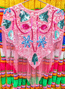 Folky florals in neon pastel brights for maximum fun and colour!!!.....this sequin cape will turn any....any ...outfit into a party outfit, sling it on over dresses, jumpsuits, T-shirts, whatever, and you will feel and look fabulous!!..then get on out to a party, festival or performance!!

One size fits all

All beads and sequins are securely sewn, pack away gently when not in use, and this will see many parties for years to come!!

 