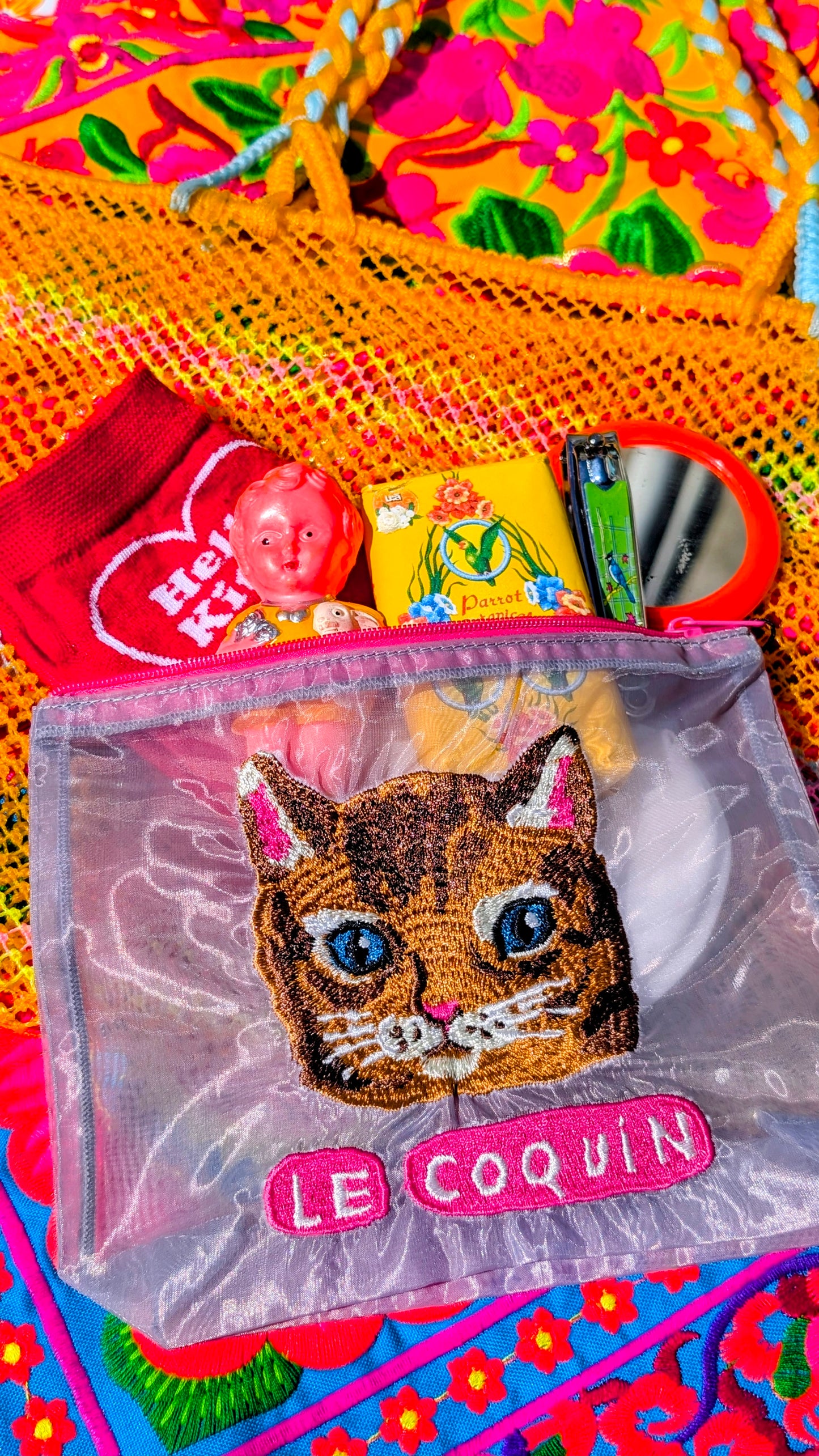 Embroidered puss pouch