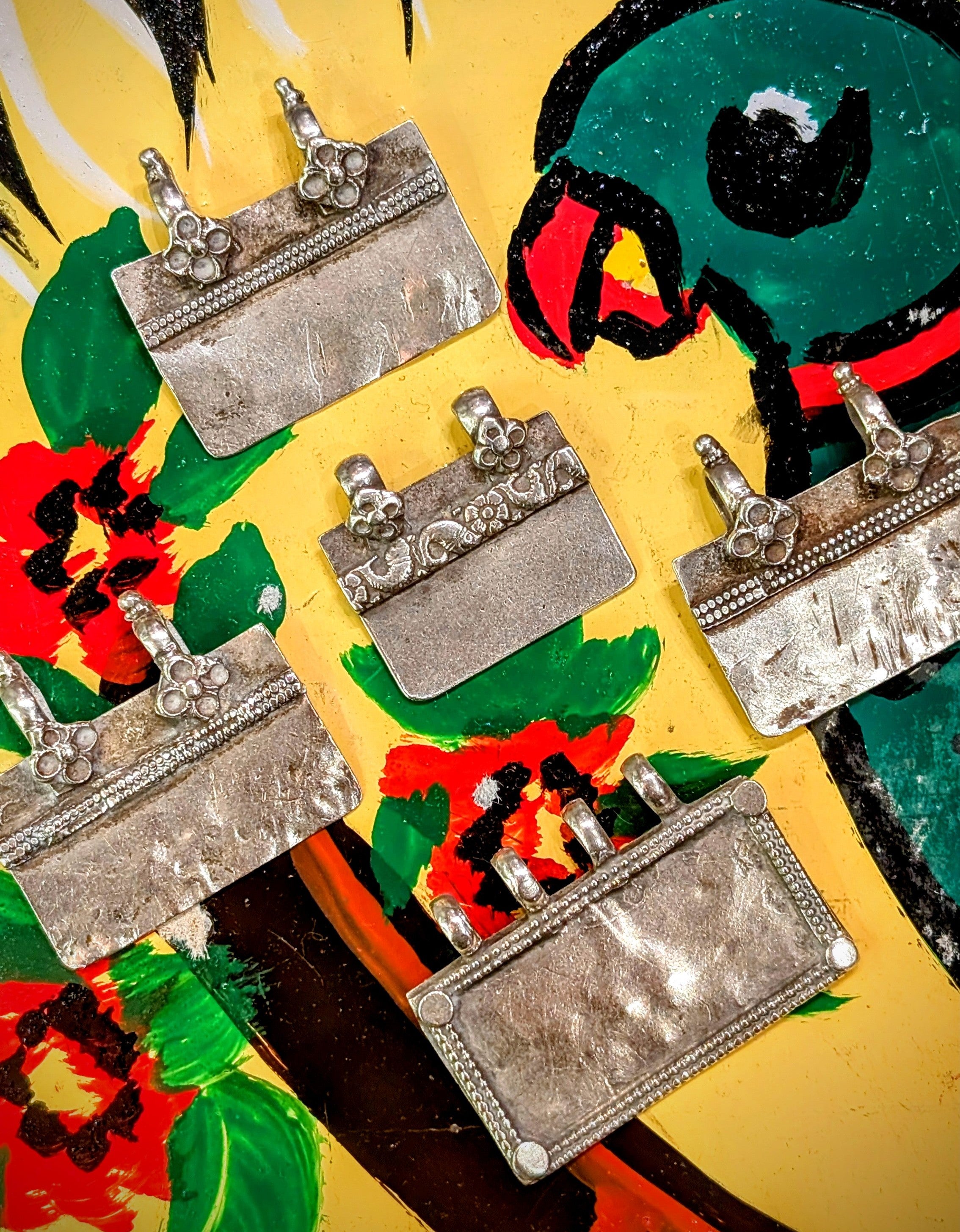 Stunning geometric ,floral, tribal style silver pendants from the nomads of Rajasthan. Beautiful wear in these pieces. 🌸
1. 3.2cm x 3cm
2. 2.5cm x 2.4cm
3. 4cm x 2.8cm
4. 3.5cm x 3cm
5. 3.4cm x 3cm




These pieces vary in wear and tear, so please examine images! Damage noted per selection.

Tribal antique silver traditionally has no hallmarks, but all that we sell have an 80-90% content, as these pieces would have been historically made from old melted down jewellery and coins.   
 Banjara silver 
