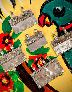 Stunning geometric ,floral, tribal style silver pendants from the nomads of Rajasthan. Beautiful wear in these pieces. 🌸
1. 3.2cm x 3cm
2. 2.5cm x 2.4cm
3. 4cm x 2.8cm
4. 3.5cm x 3cm
5. 3.4cm x 3cm




These pieces vary in wear and tear, so please examine images! Damage noted per selection.

Tribal antique silver traditionally has no hallmarks, but all that we sell have an 80-90% content, as these pieces would have been historically made from old melted down jewellery and coins.   
 Banjara silver 
