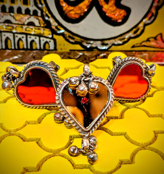 We absolutely love the super decorative hand cut mirrorwork decorations in Rajasthani shrines and these tribal heart shape rings from the same region are absolutely amazing!!, worn and made by the beautifully stylish and adorned nomads who move the animals across the desert through the seasons.

All rings are adjustable size.

Hand cut mirror set in white copper.

Heart size 3 x 3cm
Banjara
Mirror ring


 

 

 