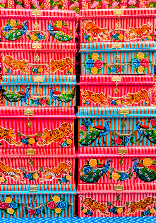 Handpainted in Pakistani by the artisans that paint the fabulously flamboyant trucks! These trunks are painted with heavy duty enamel paints onto recycled metal trunks.  Super useful, beautiful storage!!....toys, textiles, paperwork or treasures will be safe and hidden away🏵️🌺🌼
Due to their handmade and lofi production, designs may vary and also have imperfections.
Decorated at a truck depot on Pakistan, these items aren't perfect factory made pieces, its best to expect what you would in buying vintage i