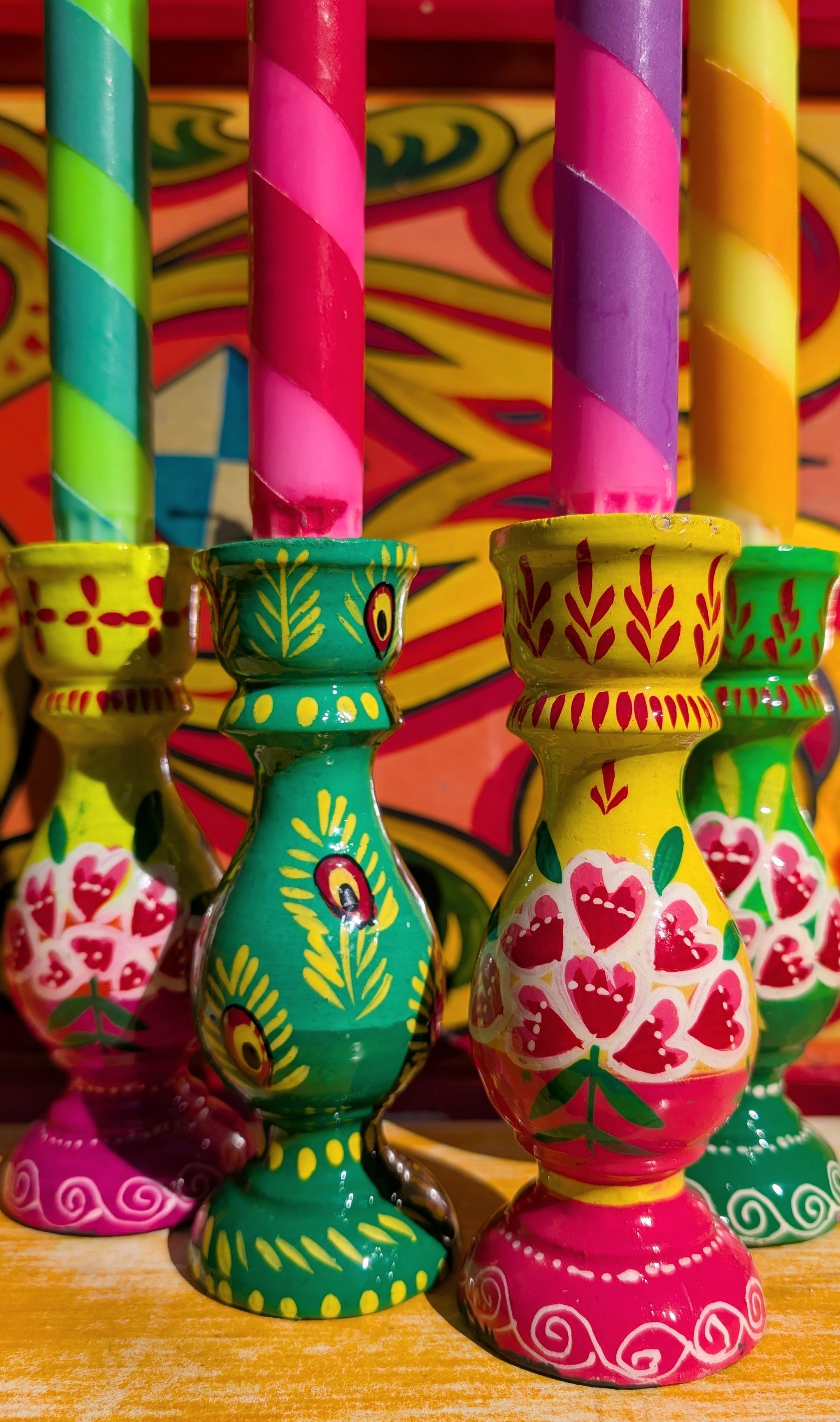 Beautifully turned wooden candle holders  handpainted in a Rajasthan, upholding traditional craft!

15cm tall, holds standard dinner candles.

These are all handpainted and vary slightly in design, they are made in a village setting, and are never perfect 😁, but that's what makes them beautiful!!

 