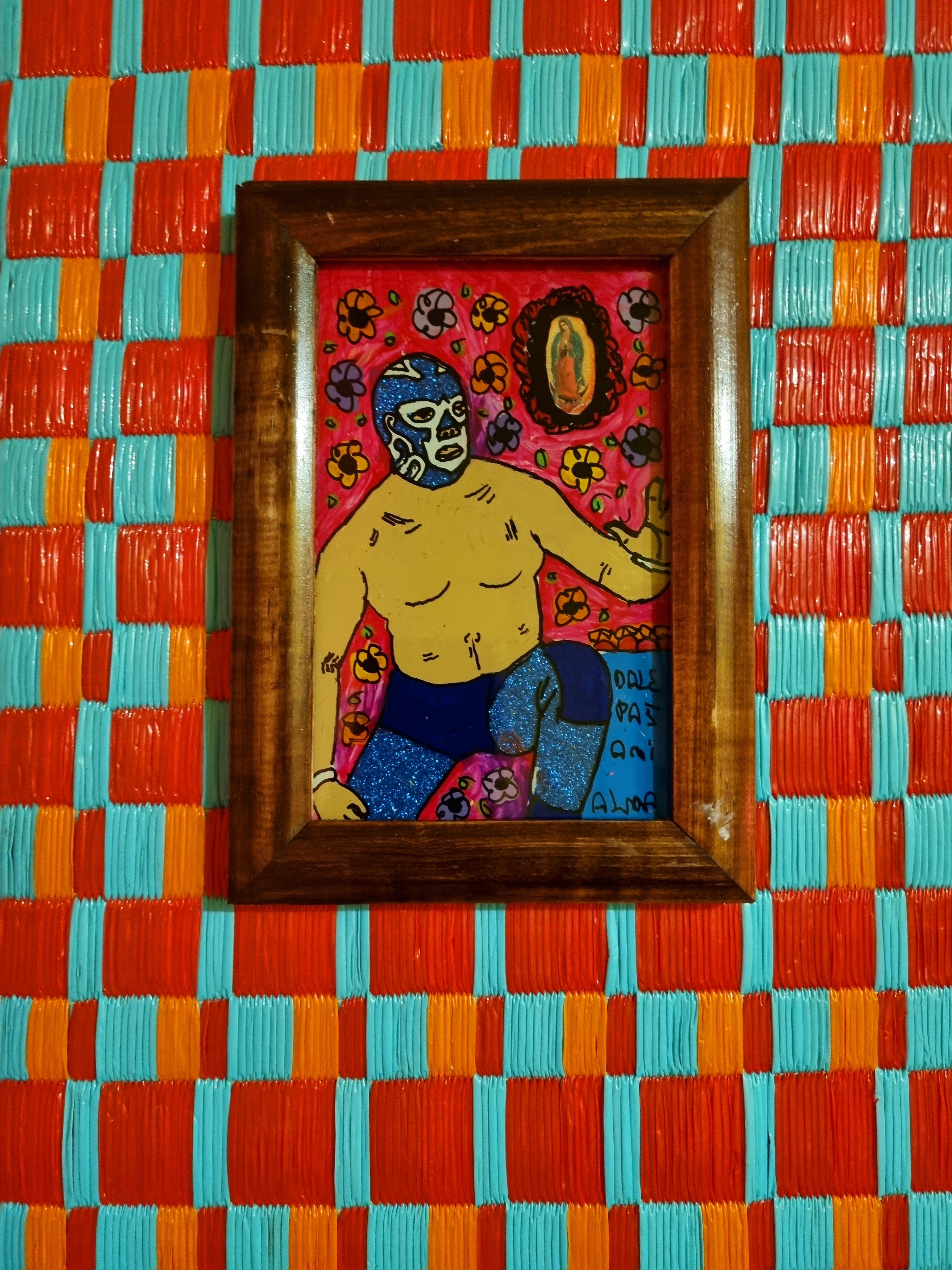 Original luchador reverse glass paintings by Manuel Bauman