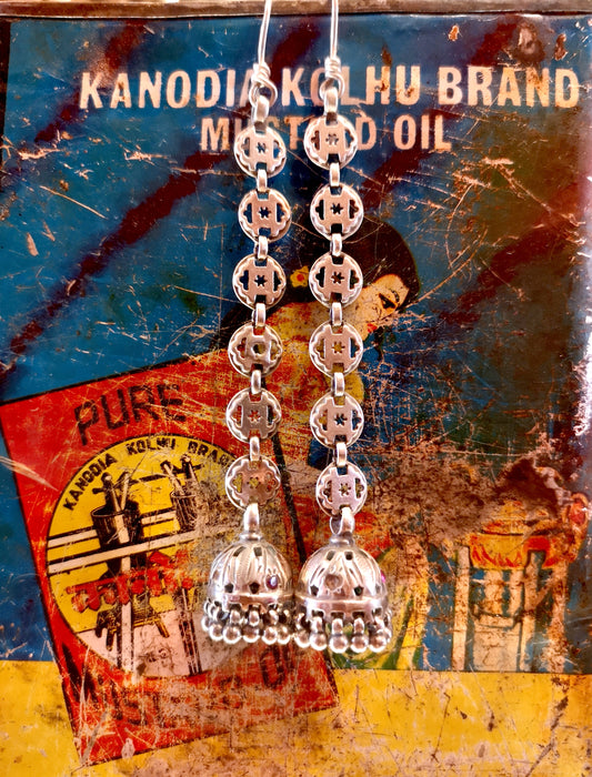 Long star pierced cage earring