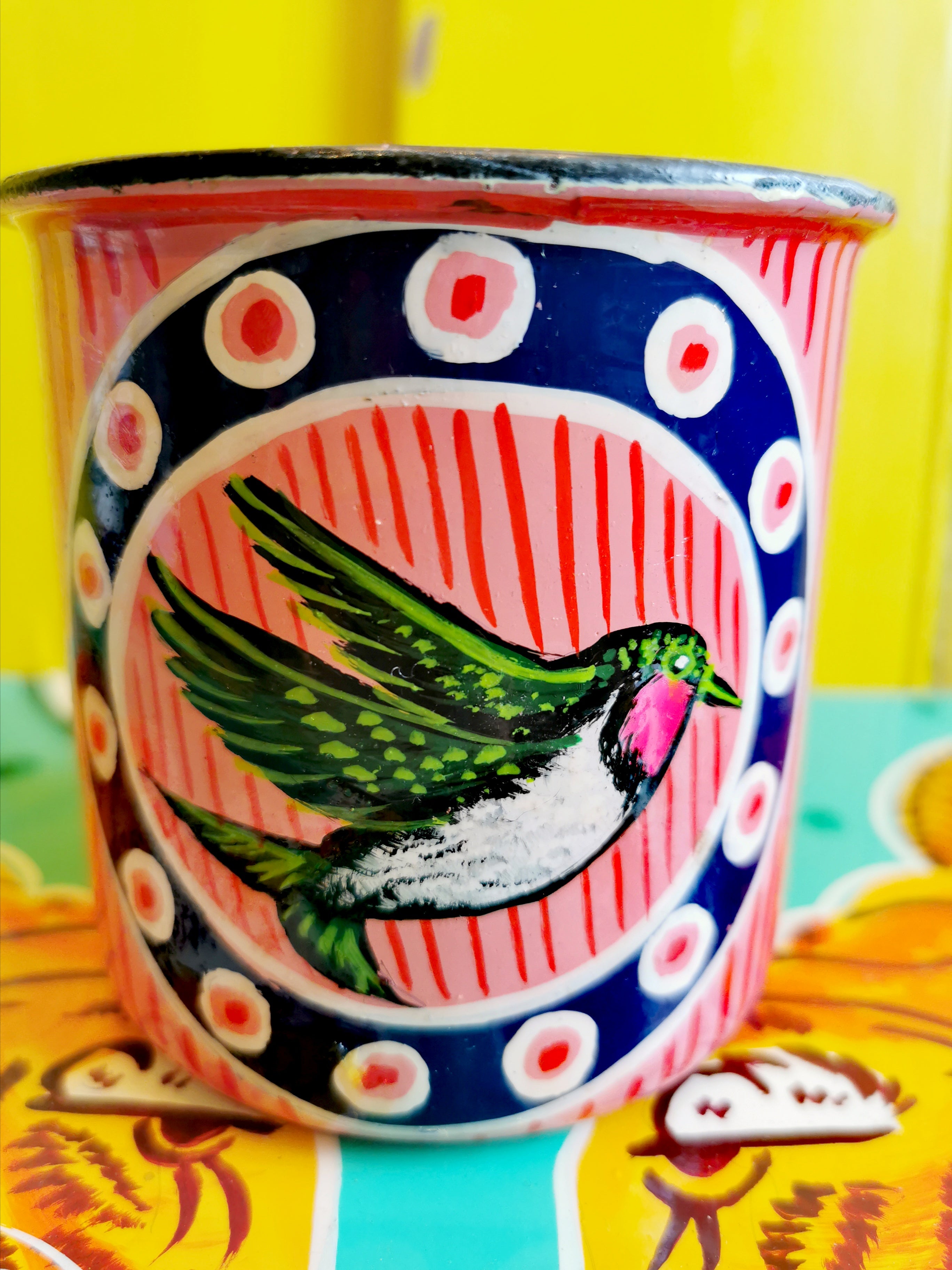  Handpainted in Pakistani by the artisans that paint the fabulously flamboyant trucks! These mugs are painted with heavy duty enamel paints onto deadstock enamelware. Suitable for light cool water washing only. Due to there handmade production, designs may vary and also have imperfections.  Dimensions 9.5cm high, 10 cm diameter   
