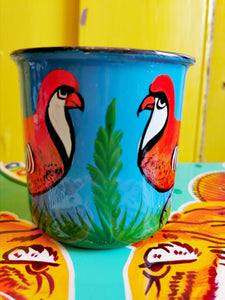  Handpainted in Pakistani by the artisans that paint the fabulously flamboyant trucks! These mugs are painted with heavy duty enamel paints onto deadstock enamelware. Suitable for light cool water washing only. Due to there handmade production, designs may vary and also have imperfections.  Dimensions 9.5cm high, 10 cm diameter   