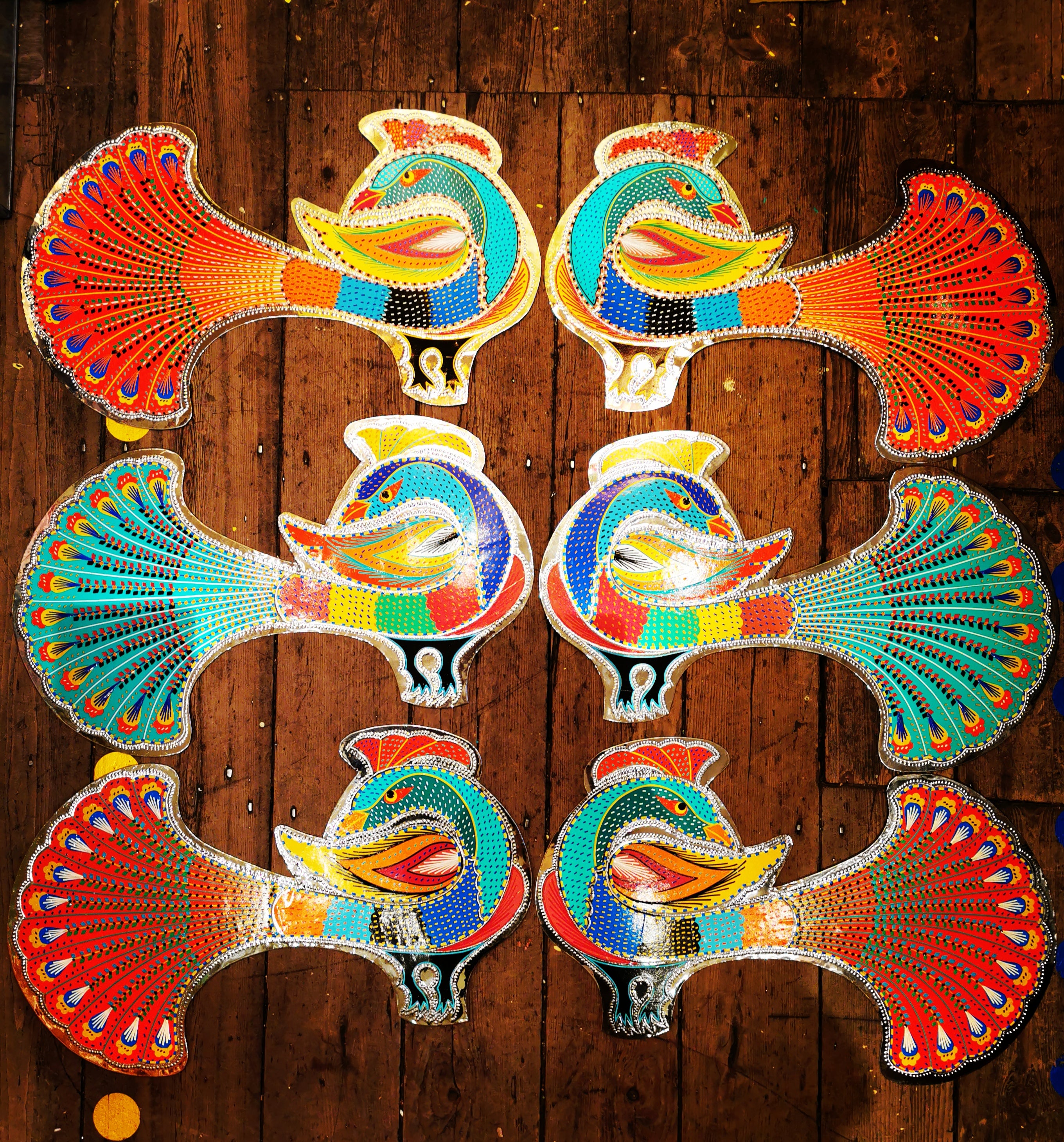 Fabulous peacock metal wall plaques, handmade in Pakistan by truck artists. Decorated beautifully with hand cut vinyl reflective stickers.