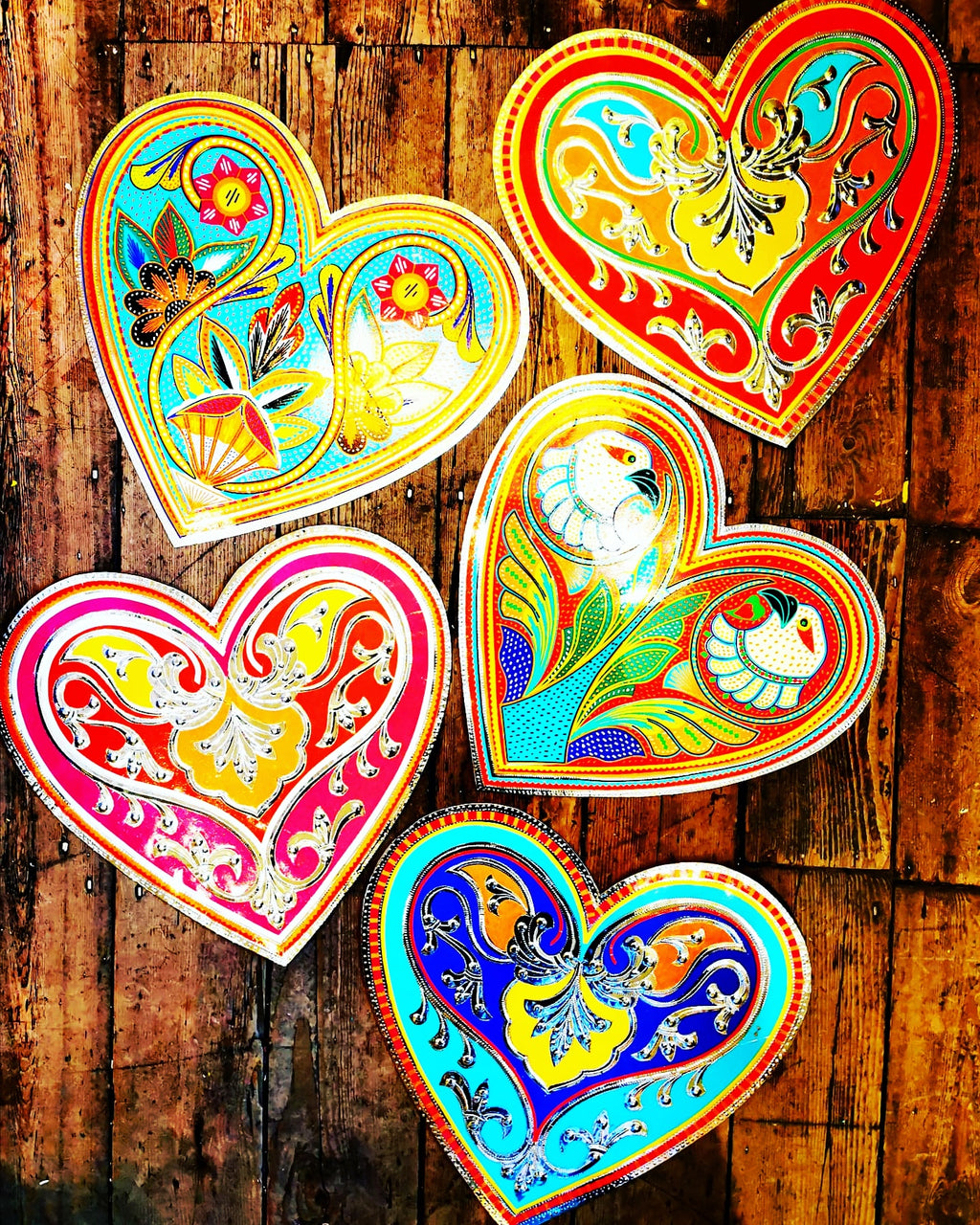 Hand made in Pakistan by the artisans that decorate the fabulously flamboyant trucks, these beautifully crafted metal plaques are decorated with hand cut reflective vinyl stickers. All so you can add a bit of folk art love to your home!

40cm x 38cm

