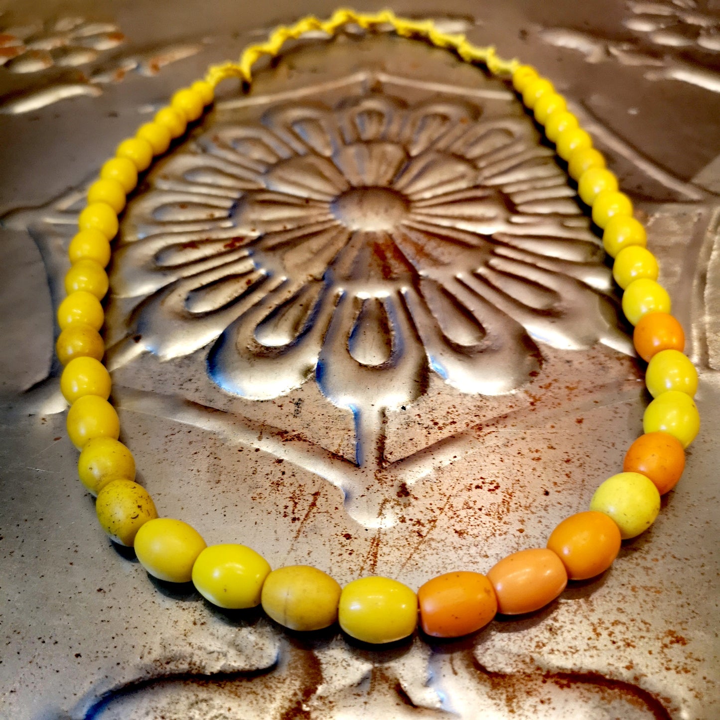 Green and yellow collection of antique and vintage trade beads