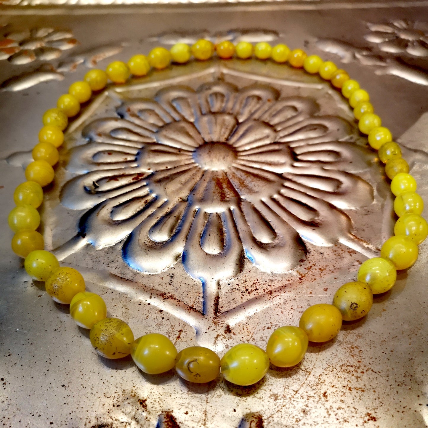 Green and yellow collection of antique and vintage trade beads