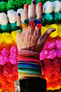 bumper bunch of rainbow colour Indian metal bangles has just got to be a cheery sight! India knows how to Accessorise! All different textures and finishes, flouro, matte, shiny, glittered. 

Material metal

Inside diameter 6.7cm


