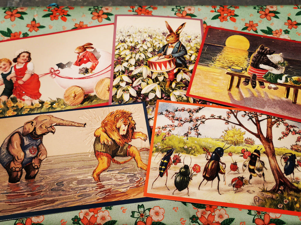 Fabulous glittered vintage style spring postcards, images taken from antique German greetings cards. Cuddling cats, playful jungle animals, hares and ants😁,all the Spring joy!

Postcards come with envelopes 

