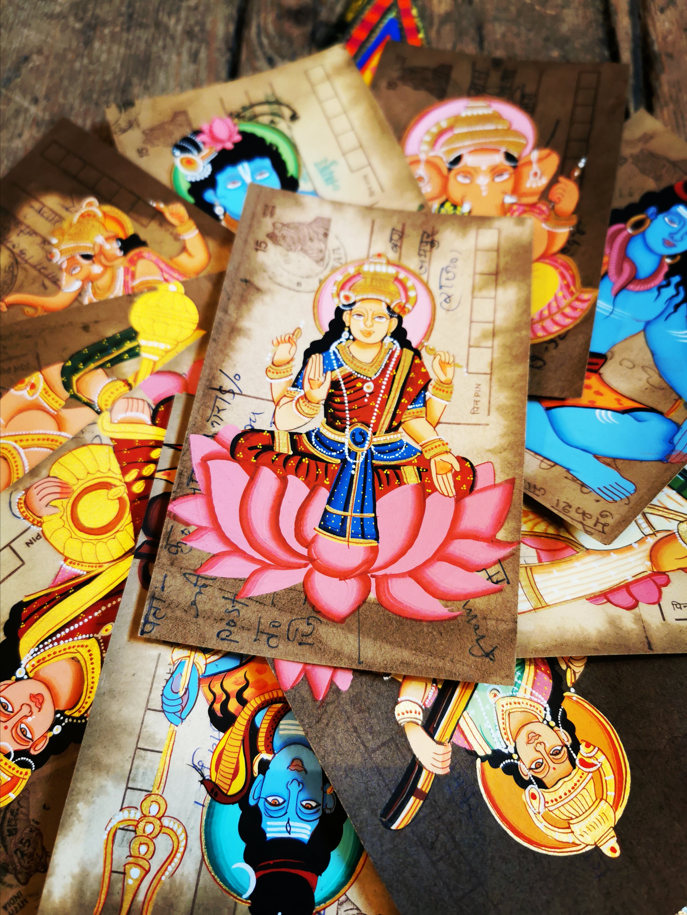 This form of painting in India is typically undertaken by the apprentices learning to paint miniatures. They often used recycled documents, letters and in this case postcards. All are original pieces.


