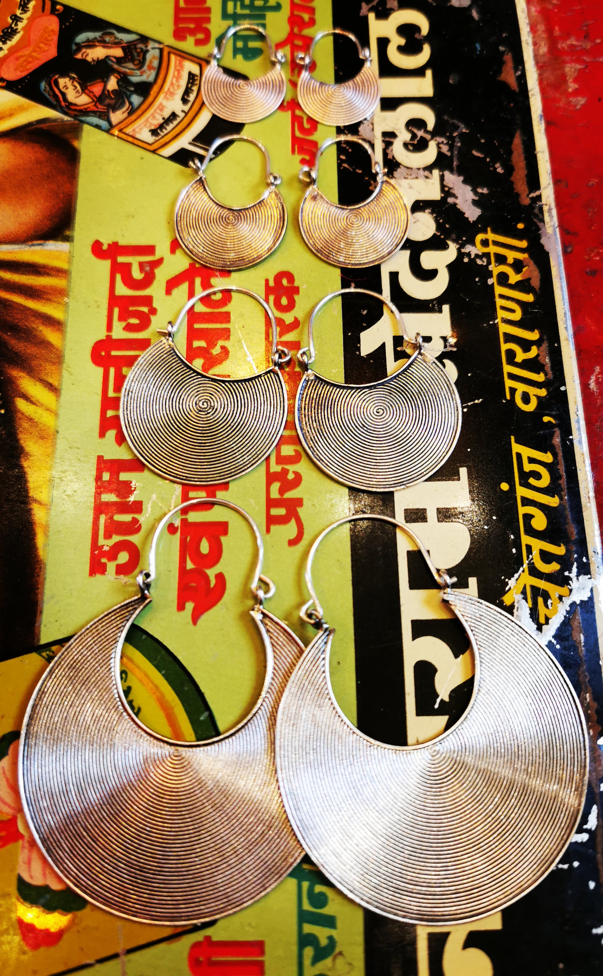 Handmade Burmese Karen spiral hoop earrings, cast design with a traditional Karen tribe fitting.

Karen Hill Tribe silver has a higher content of silver, at 99.5-99.9% compared with sterling silver at 92.5%.