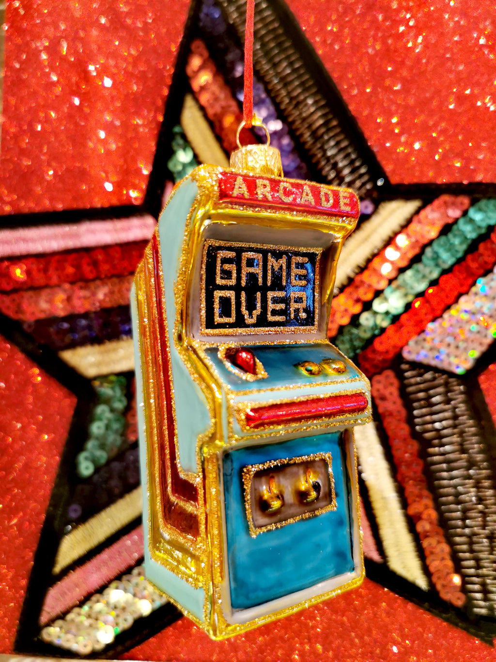 Super glitter rainbow arcade game as a glass bauble-genius!!

11cm x 5cm x 4cm


