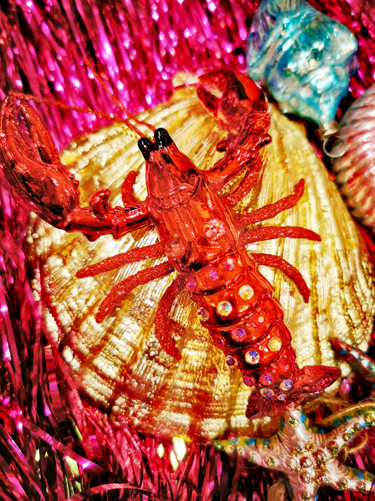 Super shiny, hand glittered, rhinestone encrusted lobster bauble, looks great on the tree or year round anywhere!!

12.5cm x 9cm x 4.5cm

