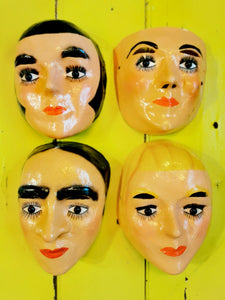 Really fabulous glass eyes in these traditional folk art masks from Mexico, and a stroke of genius to put the eye holes above in the eyebrows!

Worn in traditional festival parades. 

Hand made of paper mache and hand painted. 


