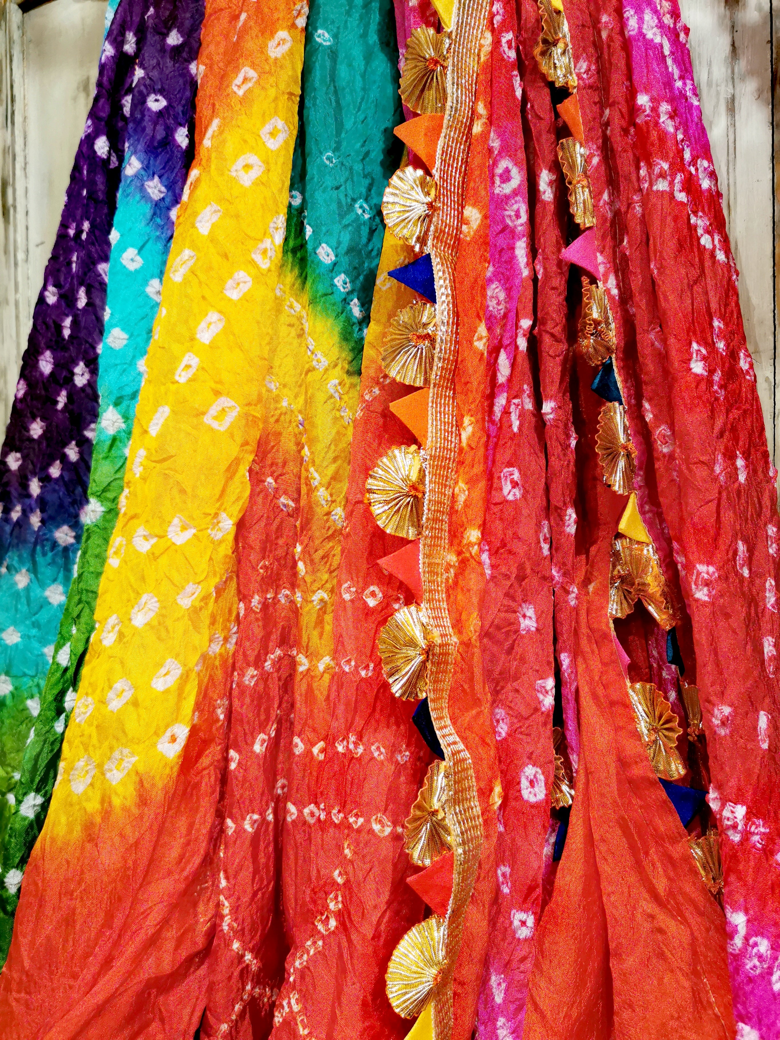 These are outrageous loud,gorgeous Indian colours with super kitsch golden textured edges, a festival, party shawl with loads of energy! 

These are handmade pieces, due to being fine silkv   pulls will occur, but having enjoyed one for years, i think it merely adds to the texture of the piece!

2m x 1m approx

