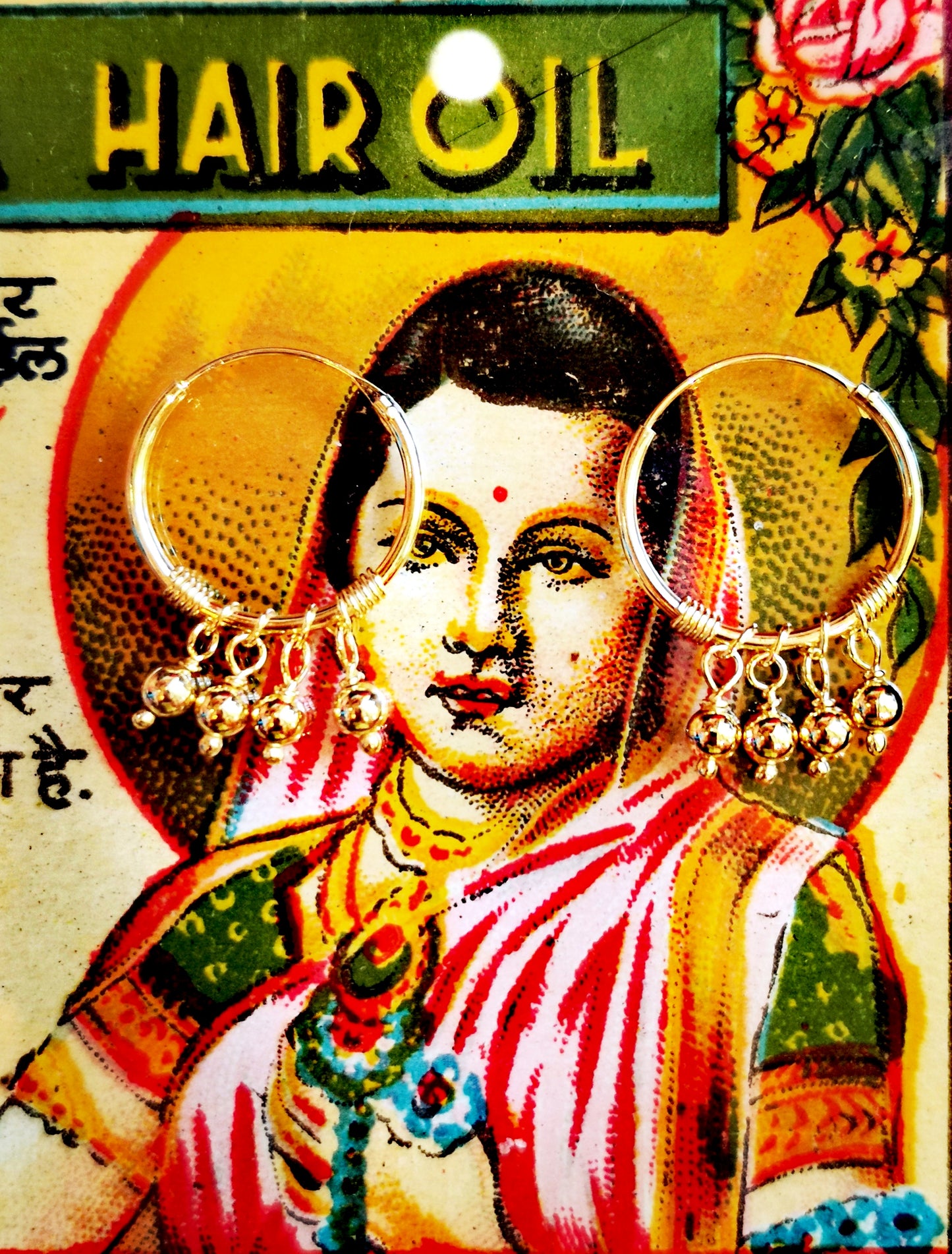 Tiny moving beads hand from these hand-wire worked hoops. 

Gold-plated silver

15mm diameter hoops

Plated jewelry must be treated with care, to keep the plate rich for as long as possible remove when washing, applying creams, using detergents etc. 

