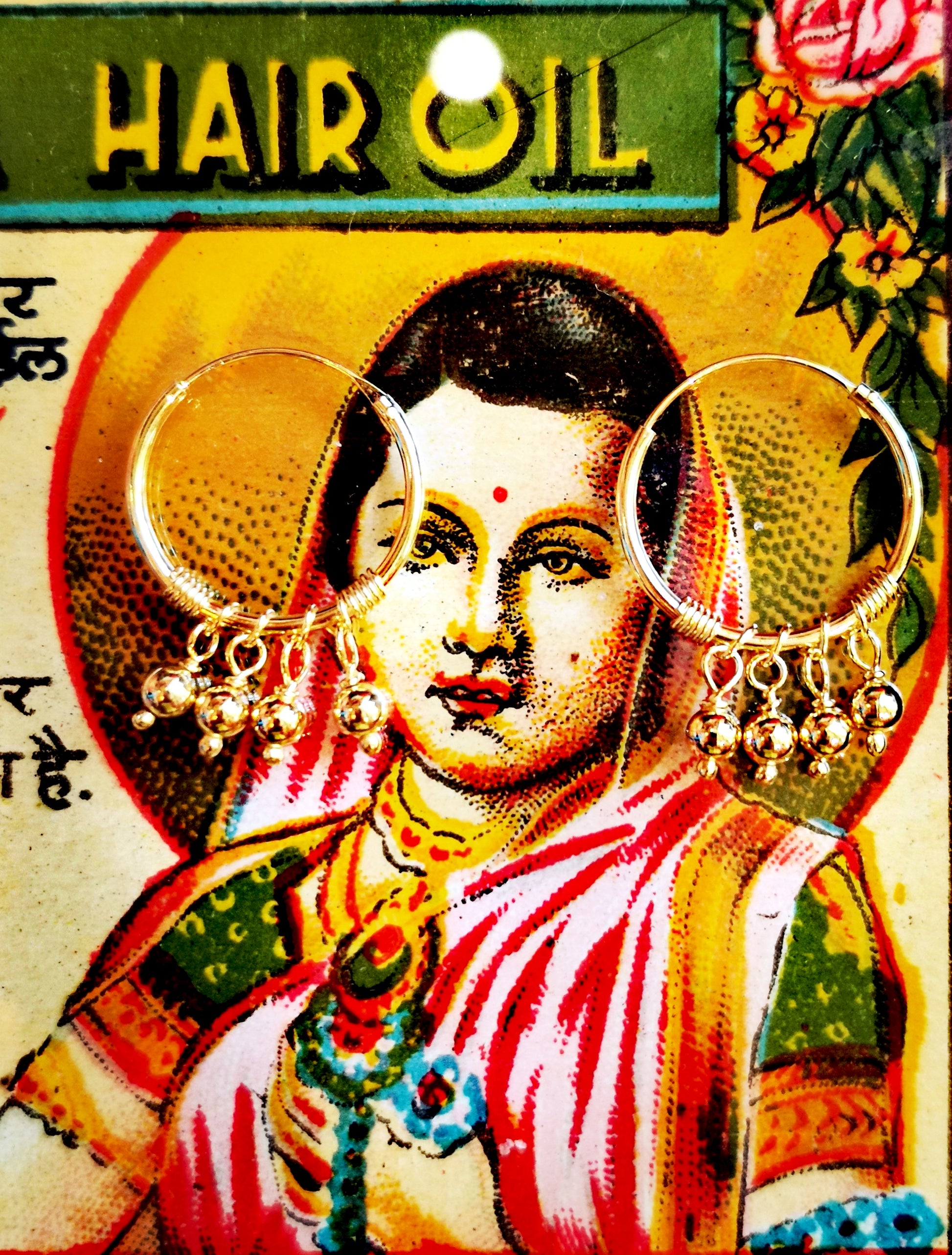 Tiny moving beads hand from these hand-wire worked hoops. 

Gold-plated silver

15mm diameter hoops

Plated jewelry must be treated with care, to keep the plate rich for as long as possible remove when washing, applying creams, using detergents etc. 

