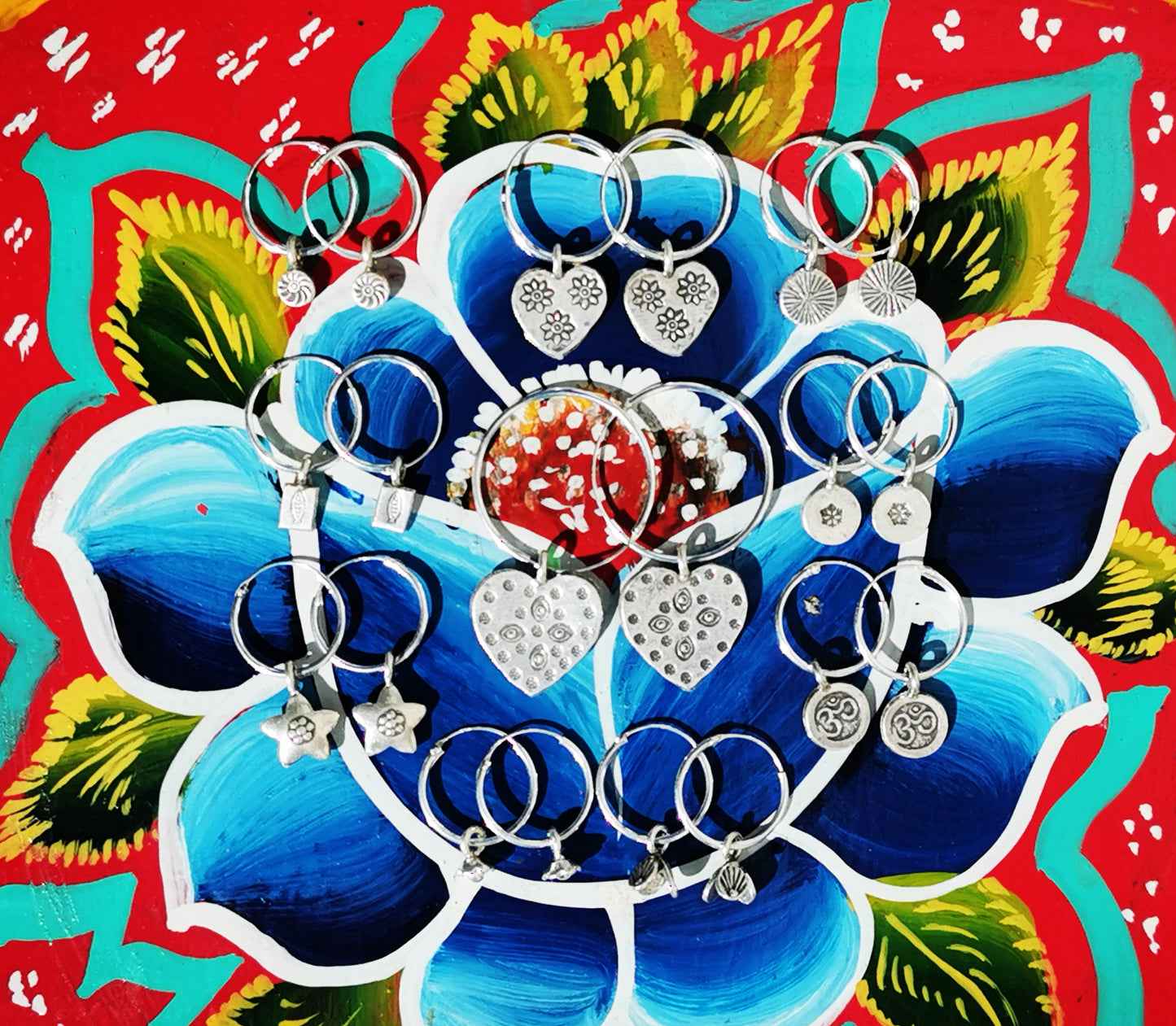 Handmade Burmese Karen tribe charms on sterling silver hoop earrings.

Great for everyday wear!

Karen Hill Tribe silver has a higher content of silver, at 99.5-99.9% compared with sterling silver at 92.5%.

