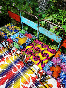 Super bold and comfy African wax print seat cushions, run them along a bench or make a chair much more comfortable

36 x 36cm approx.

Cotton outer, poly filling. 

Suitable to sponge wash.

