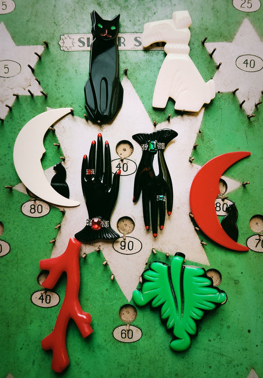 Remakes of original bakelite designs from the 1920 -50s

Created in France with stunning detail to what makes vintage jewellery super special!

All are 8.5 - 9 cm long,apart from the coral which is 11cm long.

 

 

