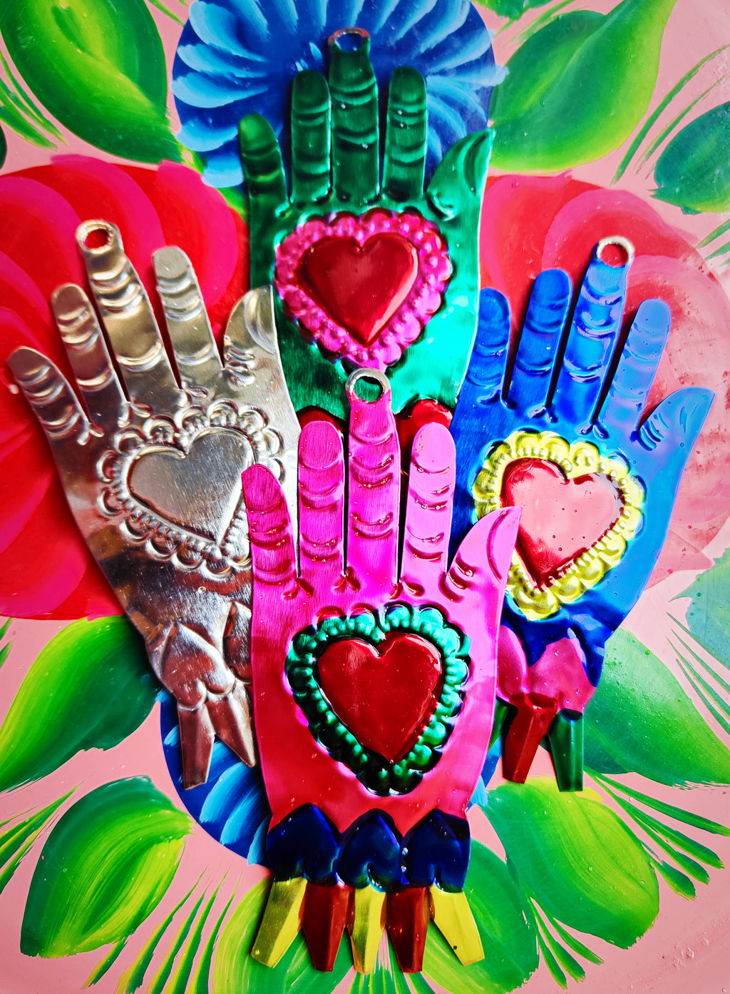 Our totally favourite small heart in hand milagros decorations made in Oaxaca, Mexico!!!

Small batch, one of a kind hand painted mexican tin hands ,hand made by local Oaxacan's on our request.

 12.5cm x 6cm


