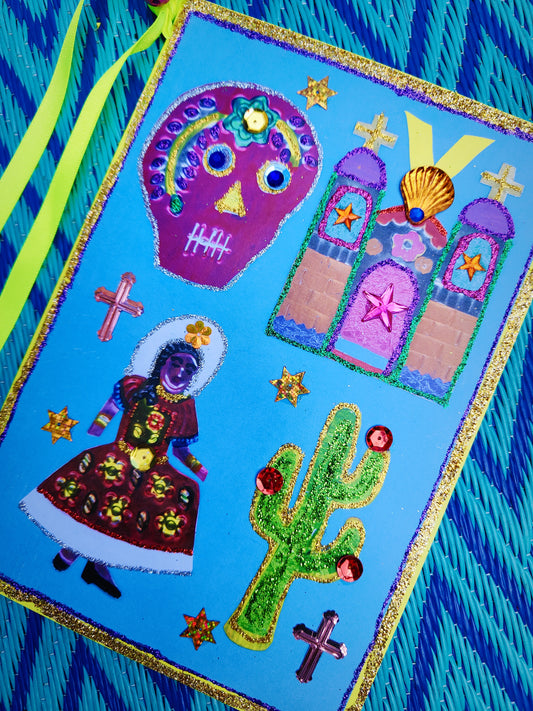Hand decorated glittery, beribboned gorgeous fancy Mexican Christmas card with bells on!!

We think these fabulous cards count as a present too, and look great framed up as well. 

Large size single card

Dimensions 21cm x 15cm

