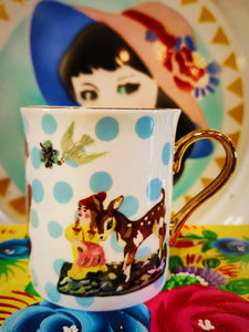 Nathalie Lete's wonderful world of joy on three beautiful bone china mug with pure gold added for good measure!! These come in a lovely gift box too.

 Size 9cm x 11cm x 7.4cm

Real gold applied so not suitable for the microwave or dishwasher.Handwash for gold happiness.

 

