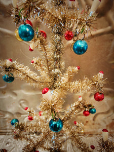 Gorgeous vintage inspired hand made tinsel trees hung with glass baubles and tiny handpainted candles to create a nostalgic Christmas,or to hang your earrings on all year round!

Small 16 x 12cm

Medium 24 x 12cm

Large 30 x 13cm

Fragile, handle with care

. Cody Foster and Co. Cody Foster. Vintage aluminium tree. Vintage tinsel . Vintage Christmas 