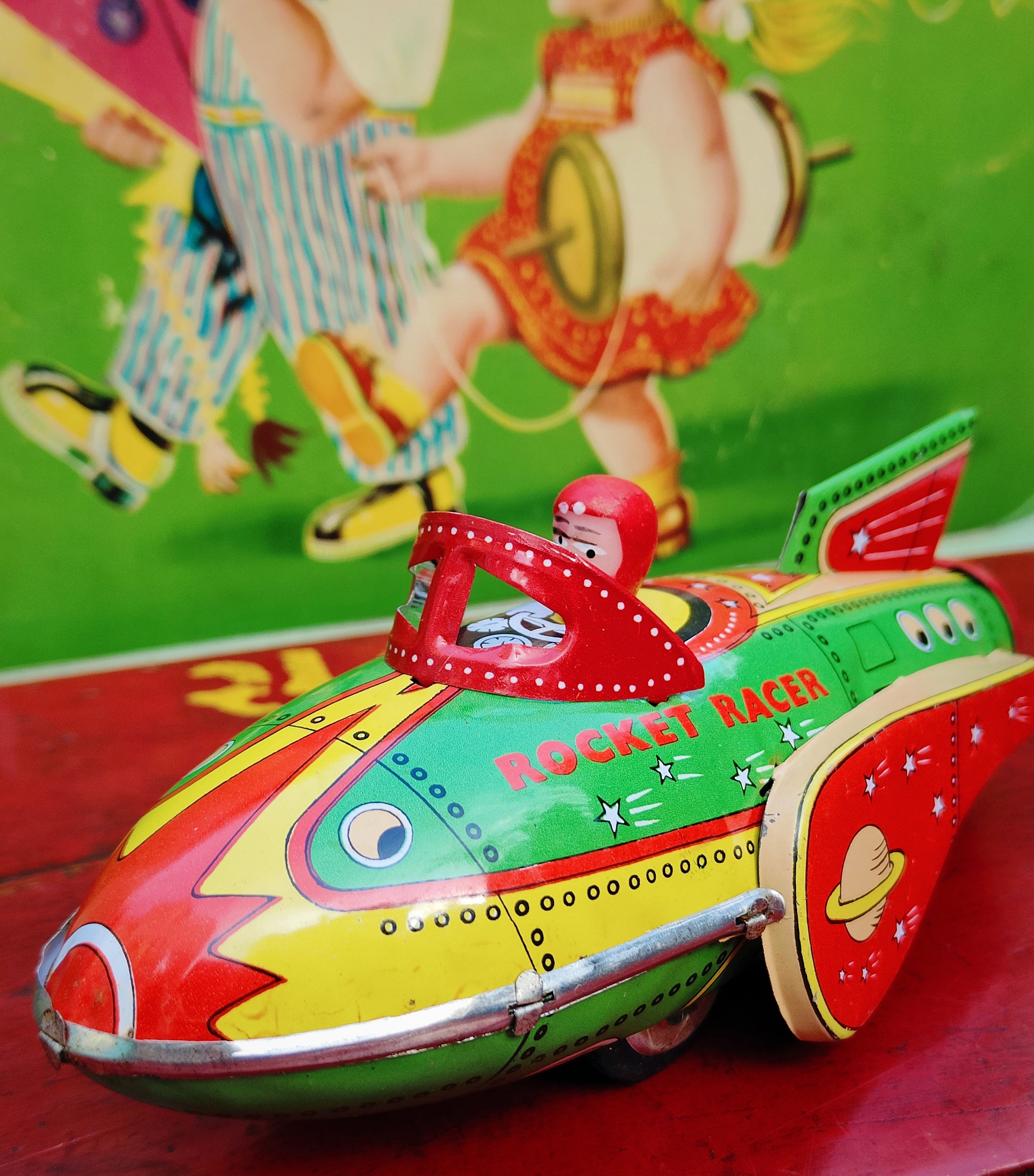 Push around with robot clicks! this super cool Rocket Racer with bonkers looking pilot!

Printed tin and plastic 

20cm x 9cm x 9cm

Not suitable as children's toy

