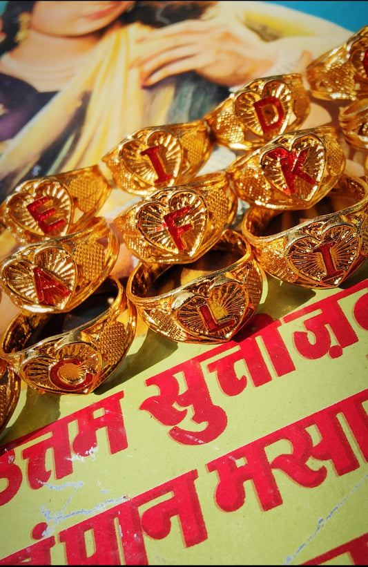 Utterly fabulous super-kitsch Indian initial rings,all are around a size P ,kind of thumb or middle finger size,but we end up wrapping a bit of coloured string around the back of we want them smaller!!

Gold plated metal

