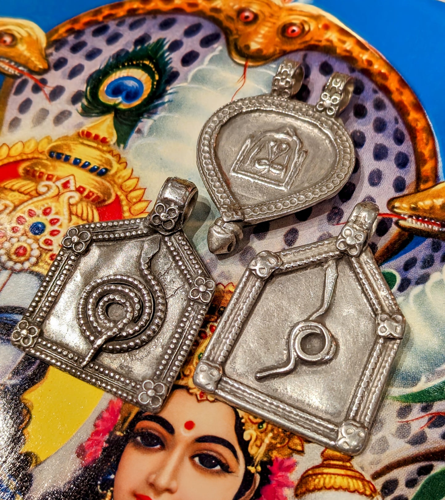 Antique silver serpent pendants
