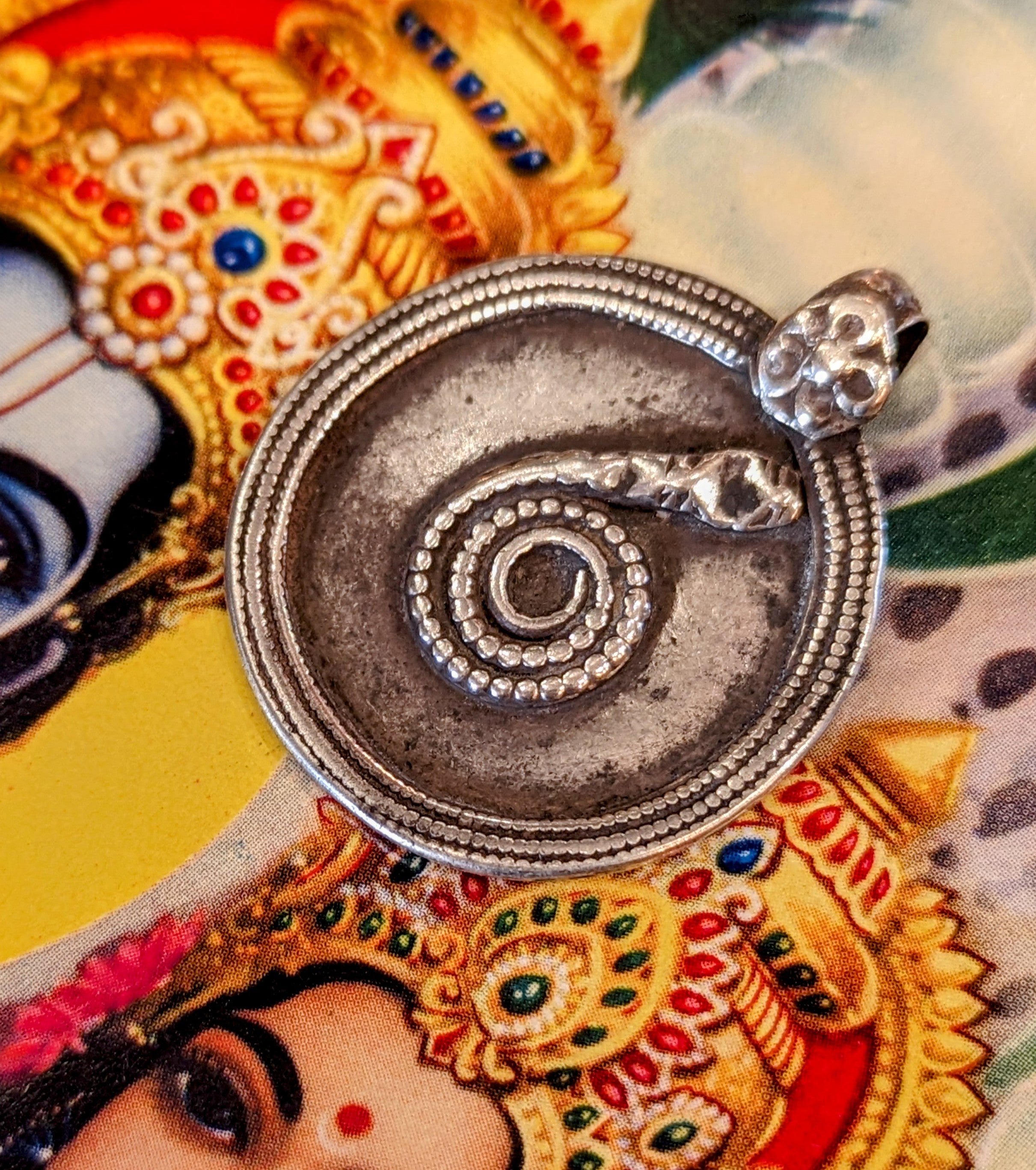 Antique silver serpent pendants