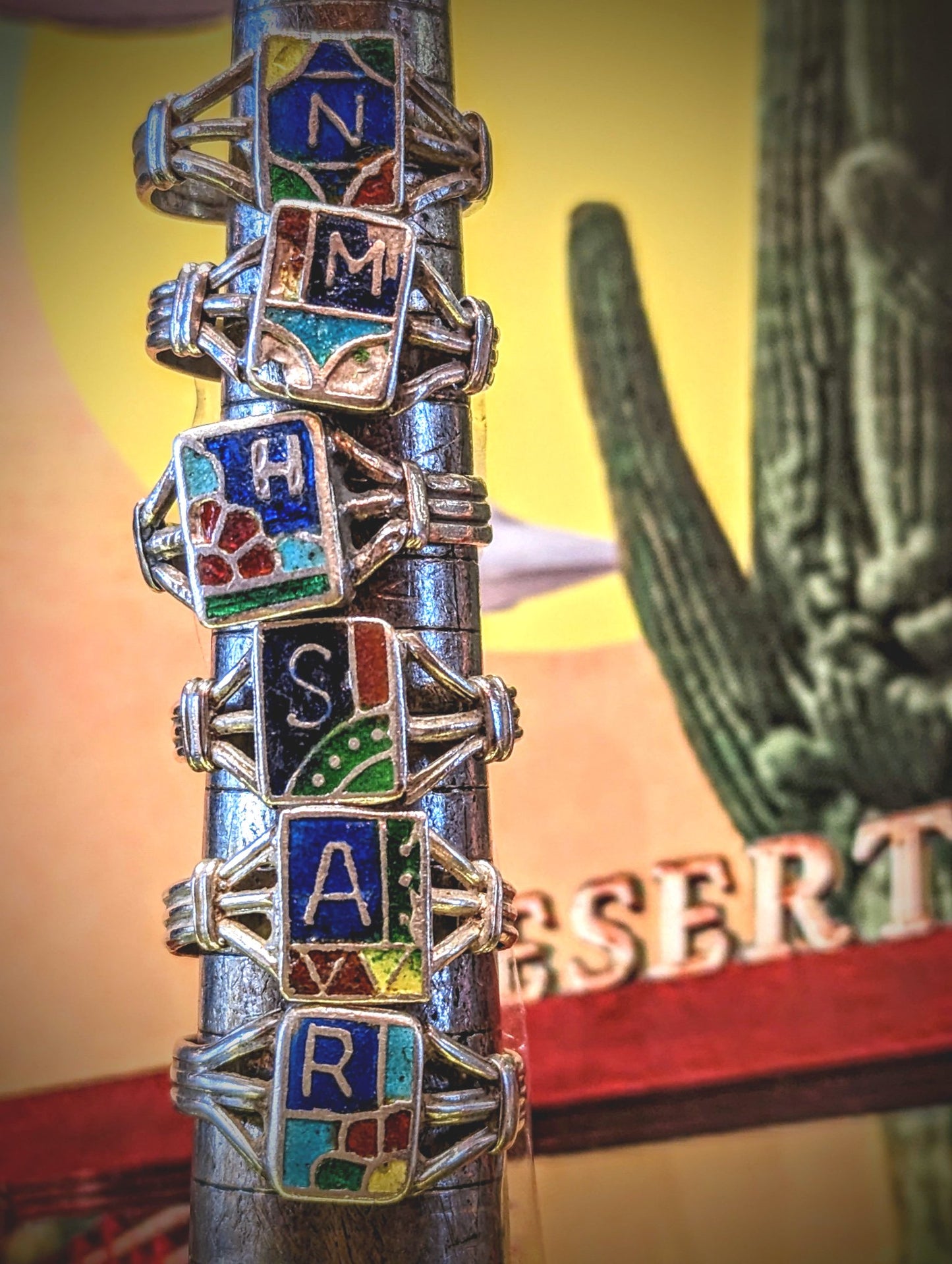 1980s Rajasthani initial rings,handmade in Pushkar around from silver with enamelled details.


These pieces vary in wear and tear, so please examine images!


Tribal antique silver traditionally has no hallmarks, but all that we sell have an 80-90% content, as these pieces would have been historically made from old melted down jewellery and coins.  

